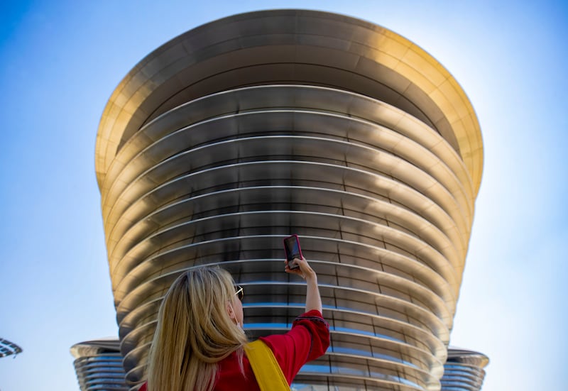 A visitor takes a picture of the spectacular Mobility Pavilion. Chris Whiteoak / The National