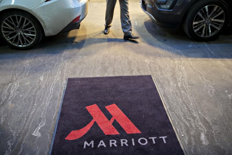 A logo is displayed on a rug outside a Marriott International Inc. hotel in Chicago, Illinois, U.S., on Friday, Nov. 30, 2018. A cyber breach in Starwood's reservation system had allowed unauthorized access to information about as many as 500 million guests since 2014. Photographer: Daniel Acker/Bloomberg