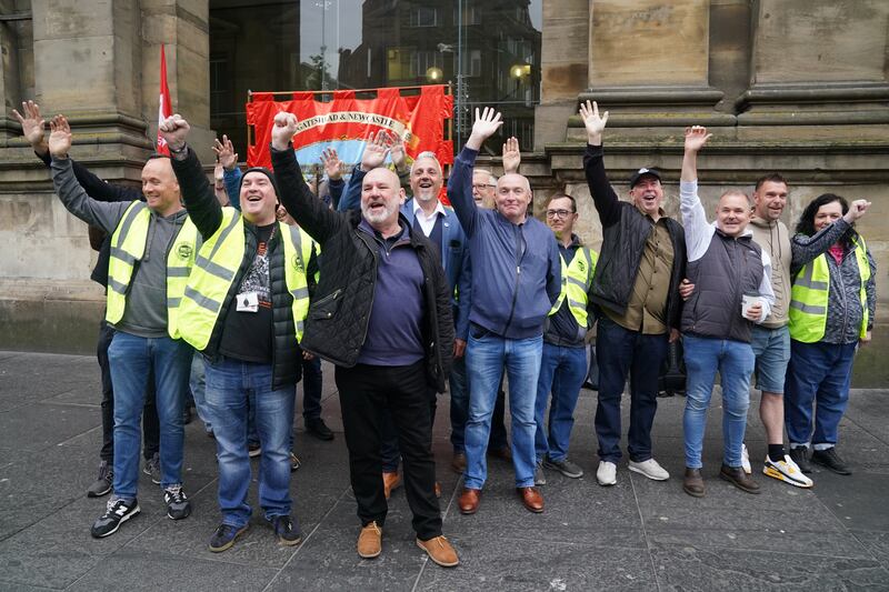 Mick Whelan, centre, general secretary of Aslef, joins union members on the picket line outside Newcastle station. PA