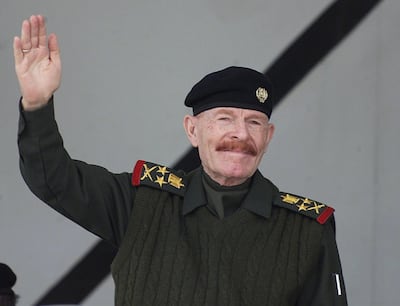 A picture dated 04 February 2003 shows Saddam Hussein's former deputy Izzat Ibrahim al-Duri saluting during a military parade in the northern city of Mosul. A person detained north of Baghdad who may or may not be Saddam's henchman al-Duri is being given DNA tests to check his identity, Iraqi Prime Minister Iyad Allawi's office said late 05 September 2004. AFP PHOTO/Awad AWAD (Photo by AWAD AWAD / AFP)