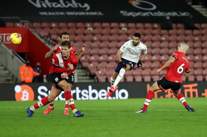 SOUTHAMPTON, ENGLAND - DECEMBER 19: Riyad Mahrez of Manchester City takes a shot during the Premier League match between Southampton and Manchester City at St Mary's Stadium on December 19, 2020 in Southampton, England. A limited number of fans (2000) are welcomed back to stadiums to watch elite football across England. This was following easing of restrictions on spectators in tiers one and two areas only. (Photo by Naomi Baker/Getty Images)