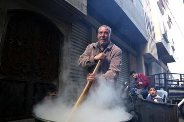 57-year-old Walid Al Hattab makes groats for the poor of Gaza. Fady Hossam for The National