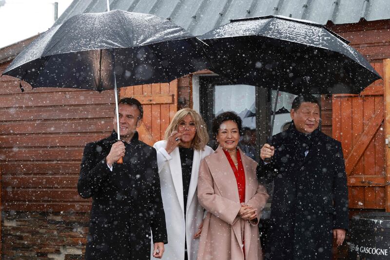 French President Emmanuel Macron, China's Xi Jinping and their wives Brigitte Macron and Peng Liyuan spent Tuesday holding private talks in the Pyrenees mountains. AFP