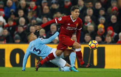 Soccer Football - Premier League - Liverpool vs Manchester City - Anfield, Liverpool, Britain - January 14, 2018   Manchester City's Danilo in action with Liverpool's Roberto Firmino       REUTERS/Phil Noble    EDITORIAL USE ONLY. No use with unauthorized audio, video, data, fixture lists, club/league logos or "live" services. Online in-match use limited to 75 images, no video emulation. No use in betting, games or single club/league/player publications.  Please contact your account representative for further details.