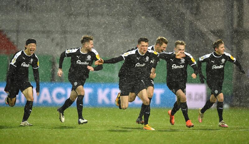 Holstein Kiel celebrate after winning the penalty shootout. Getty