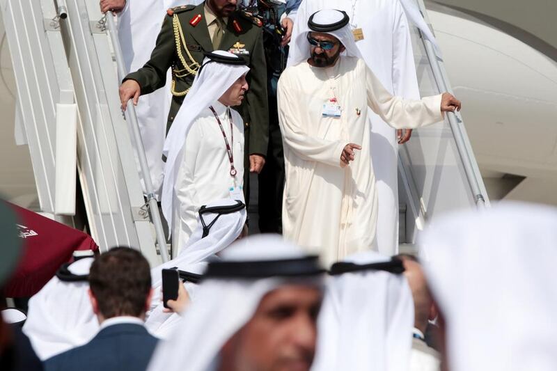 Sheikh Mohammed bin Rashid speaks with Akbar Al Baker, chief executive of Qatar Airways, at Dubai Airshow. Christopher Pike / The National