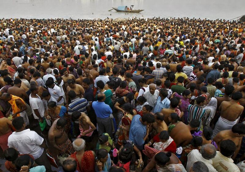 Hindus gather to perform prayers on the banks of the Ganges River on the holy day of Mahalaya in Kolkata, India. Rupak De Chowdhuri / Reuters
