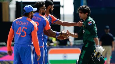 India's Hardik Pandya (2nd L) shakes hands with Pakistan's Naseem Shah (R) after India defeated Pakistan during the ICC men's Twenty20 World Cup 2024 group A cricket match at Nassau County International Cricket Stadium in East Meadow, New York on June 9, 2024.  (Photo by TIMOTHY A.  CLARY  /  AFP)