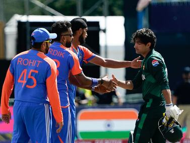 India's Hardik Pandya (2nd L) shakes hands with Pakistan's Naseem Shah (R) after India defeated Pakistan during the ICC men's Twenty20 World Cup 2024 group A cricket match at Nassau County International Cricket Stadium in East Meadow, New York on June 9, 2024.  (Photo by TIMOTHY A.  CLARY  /  AFP)