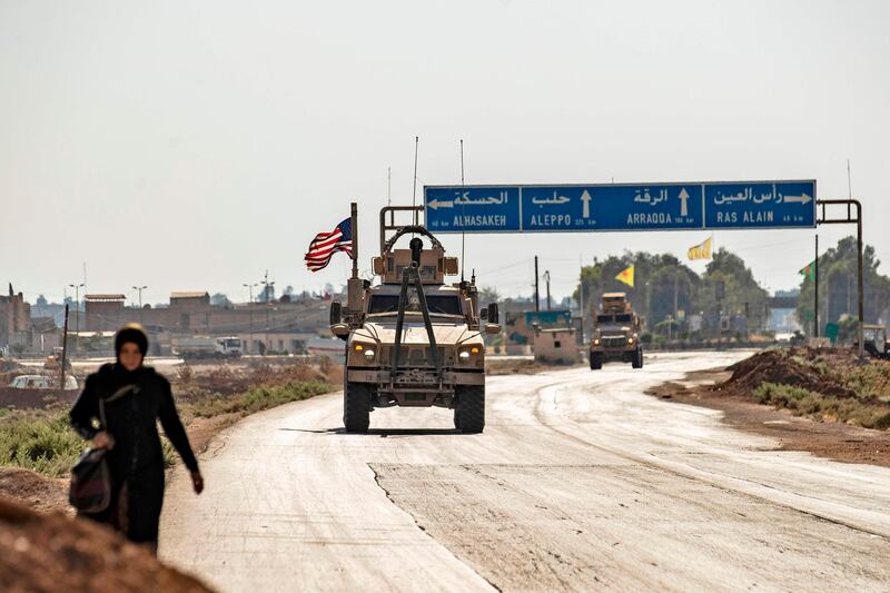 US forces patrol the area of the town of Tal Tamr, in Syria's northeastern Hasakeh province, on August 17, 2020. The US-led coalition in Syria said a patrol had come under attack and engaged in a firefight near the pro-government checkpoint in the country's northeast. The Britain-based Syrian Observatory for Human Rights earlier reported that two Syrian soldiers were killed in a coalition airstrike near the city of Qamishli.
 / AFP / DELIL SOULEIMAN
