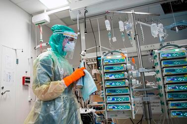 A nurse wearing a face shield and a mask in a hospital in Sweden. AFP