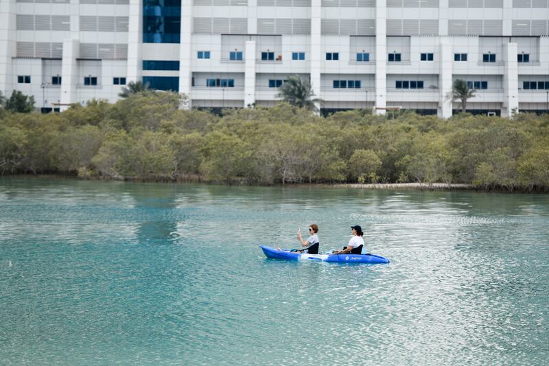 Kayakers at Reem Central Park, Abu Dhabi, on the first day of the Eid holiday. Khushnum Bhandari / The National
