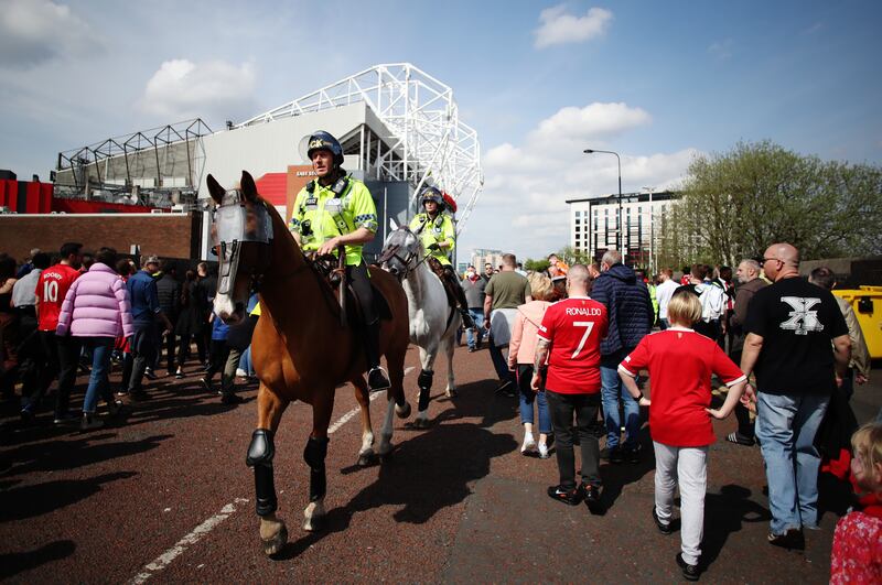  Police outside the stadium as fans arrive. Getty