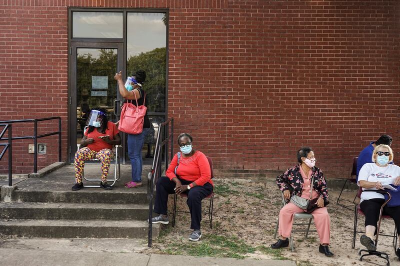 People wait in line to cast their ballots for the upcoming presidential election as early voting begins in Houston, Texas, U.S. REUTERS