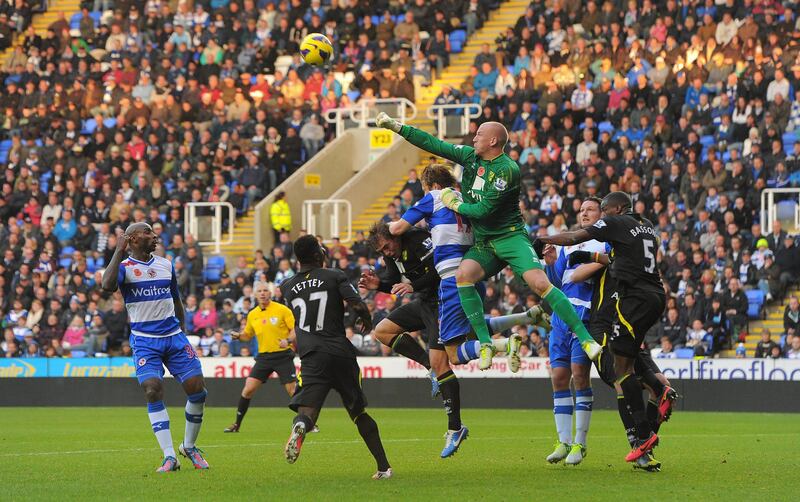 Norwich City goalkeeper John Ruddy, centre,  punches  the ball clear during their Premier League soccer match against Reading,  at the Madjeski Stadium, in Reading, England, Saturday Nov. 10, 2012. (AP Photo/ Andrew Matthews, PA) UNITED KINGDOM OUT  NO SALES  NO ARCHIVE *** Local Caption ***  English Premier League Soccer.JPEG-08bb2.jpg