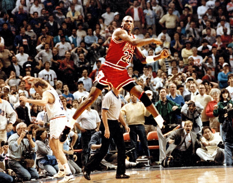 The Chicago Bulls' Michael Jordan reacts after hitting the game-winning basket over Cleveland's Craig Ehlo, left rear, in Game 5 of the NBA playoffs May 7, 1989, in Cleveland, Ohio.  (Ed Wagner Jr./Chicago Tribune/Tribune News Service via Getty Images)