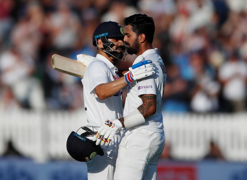 India's KL Rahul celebrates his century with captain Virat Kohli.