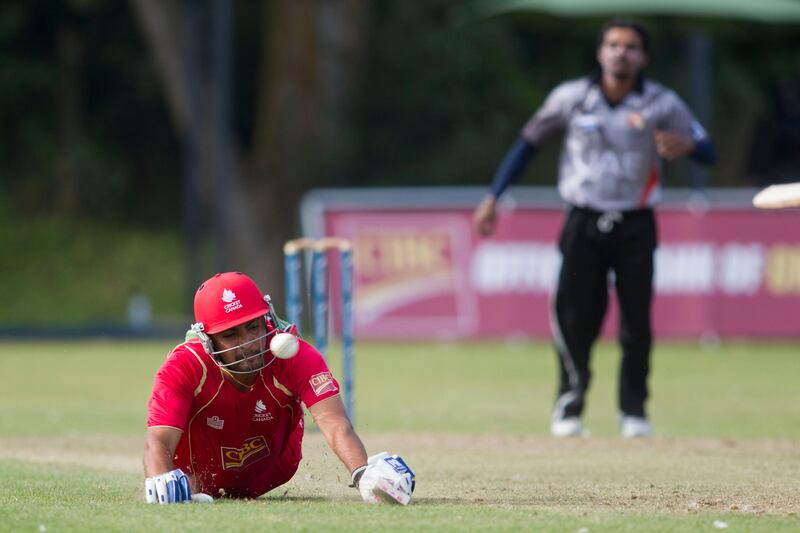 KING CITY, CANADA : August 6, 2013   Canada batsman Havir Baidwan dives safely for the crease as UAE bowler Nasir Aziz looks on  during the one day international  at the Maple Leaf Cricket club in King City, Ontario, Canada ( Chris Young/ The National). For Sports *** Local Caption ***  chy218.jpg