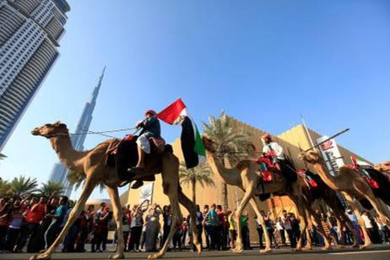 Dubai, United Arab Emirates-December 02, 2012;  Dubai residents participate in the Parade  to mark the UAE's 41st National Day at the Burj Downtown in  Dubai . (  Satish Kumar / The National ) For News