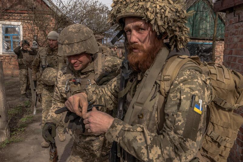 Ukrainian infantry soldiers of the 23rd Mechanised Brigade prepare to head for the frontline near Avdiivka, in the Donetsk region, on April 3, 2024. AFP