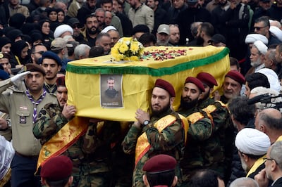 Mourners carry the coffin of Hezbollah official Mohammad Abdul Rasoul Alawieh in Beirut, on February 24. EPA
