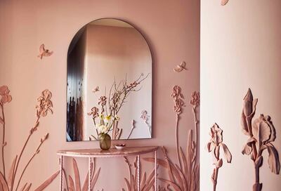 Wedgwood Jasperware-inspired floral artwork in the hallway of the apartment. Photo: Almacantar