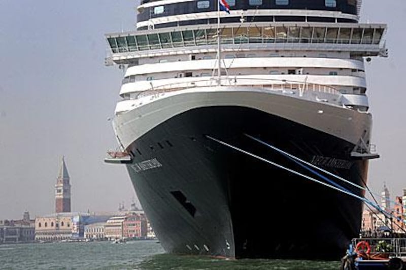 A cruise liner sits in port in Venice. Residents are concerned that pollution and more tourists are threatening the city's foundations.