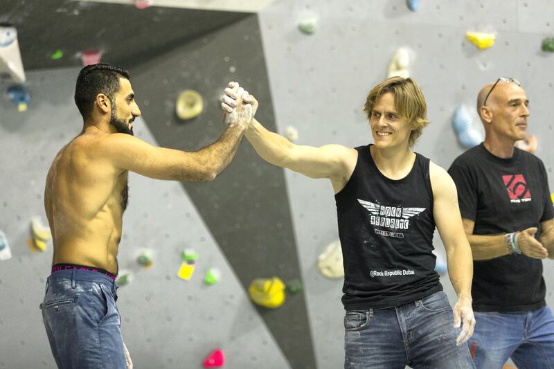 Dubai, United Arab Emirates, August 26, 2017:  Hamad Sajwani of UAE, left, and Jan-Georg Wagenfeld of Germany celebrate winning first and second respectively during the finals of the  Boulder Bash climbing competition at Rock Republic climbing gym in the Dubai Investment Park area of Dubai on August 26, 2017. Bouldering is a form of climbing, that has no ropes, but focuses on very physical and technical problems closer to the ground and is one of the three disciplines that will be included in the 2020 Olympics. Christopher Pike / The National

Reporter: Roberta Pennington
Section: News