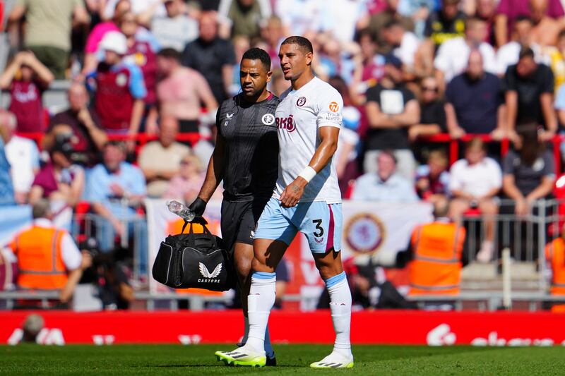 Aston Villa defender Diego Carlos limps off the pitch after picking up an injury early in the game. AP