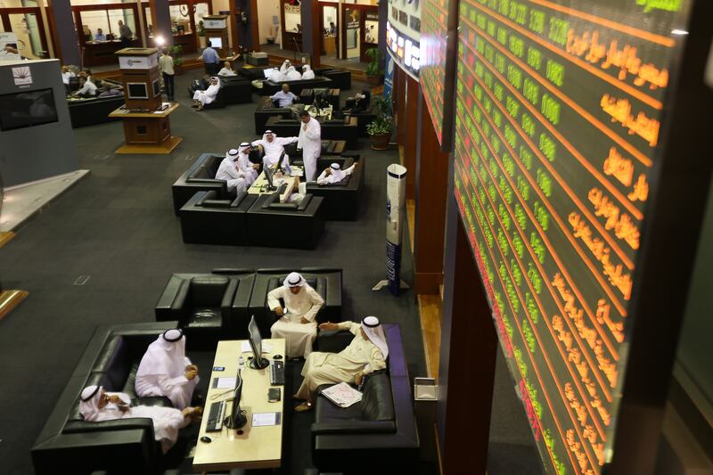 DUBAI , UNITED ARAB EMIRATES Ð Oct 12 , 2014 : Traders doing business in the Dubai Financial Market at Dubai World Trade Centre in Dubai. ( Pawan Singh / The National ) For Business. 
