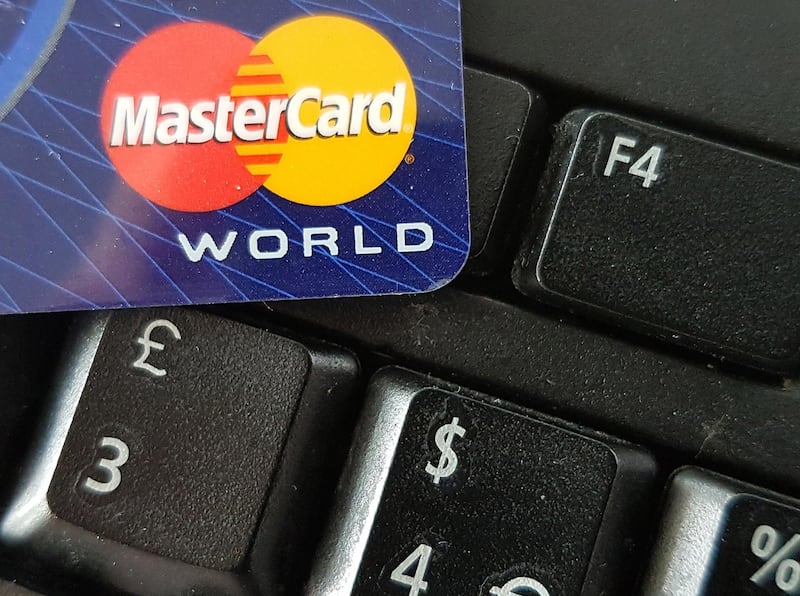 epa07308763 (FILE) - A close-up image showing a Mastercard credit card on a computer keyboard in Frankfurt, Germany, 10 September 2016 (reissued 22 January 2019). Media reports state Mastercard has been fined 570 million Euros by EU competition authorities over excessive fees.  EPA/MAURITZ ANTIN