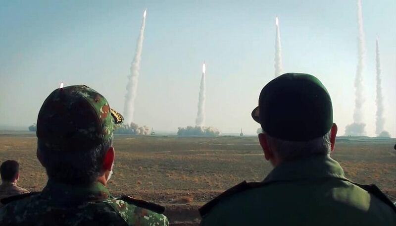 epa08938613 A handout photo made available by the Iranian Revolutionary Guard Corps (IRGC) official website (Sepahnews) shows, Iranian Revolutionary Guard Corps (IRGC) chief Hossein Salami (R) watches as missiles launch during a military drill in an unknown location, central Iran, 15 January 2021. Media reported that Iran has tested its new generation of missiles and drones during the drill. Following tensions between Iran and US, Iranian IRGC  began a missile drill in the central desert of Iran.  EPA/SEPAHNEWS / HANDOUT  HANDOUT EDITORIAL USE ONLY/NO SALES
