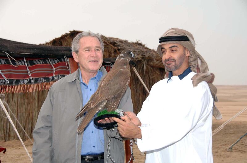 Sheikh Mohamed introduces US President George W Bush to a falcon in Sweihan, Abu Dhabi, on January 14, 2008. Mr Bush was on a Middle East tour. Photo: National Archives