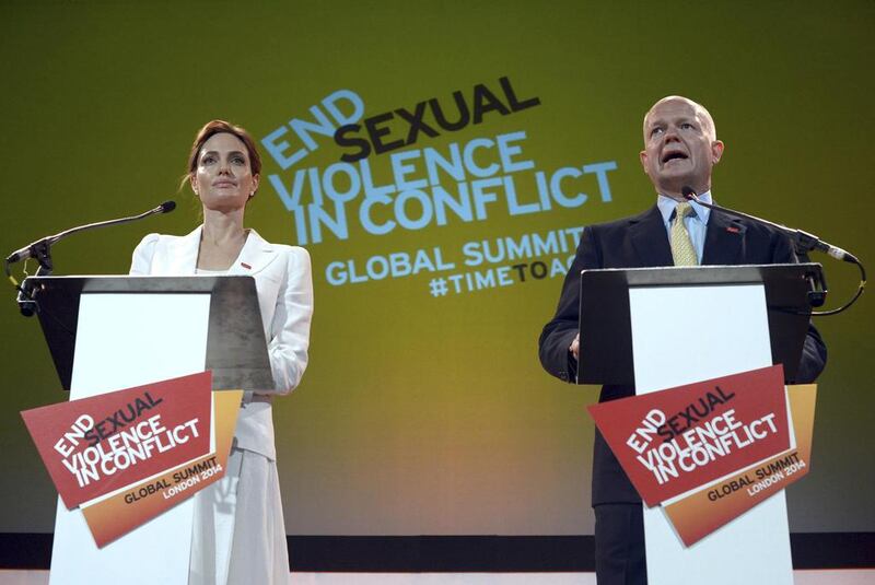 Actress and special envoy of the UN High Commissioner for Refugees (UNHCR), Angelina Jolie, and British Foreign Secretary William Hague at a global summit to end sexual violence in conflict, held in London on June 10, 2014. Carl Court/Reuters
