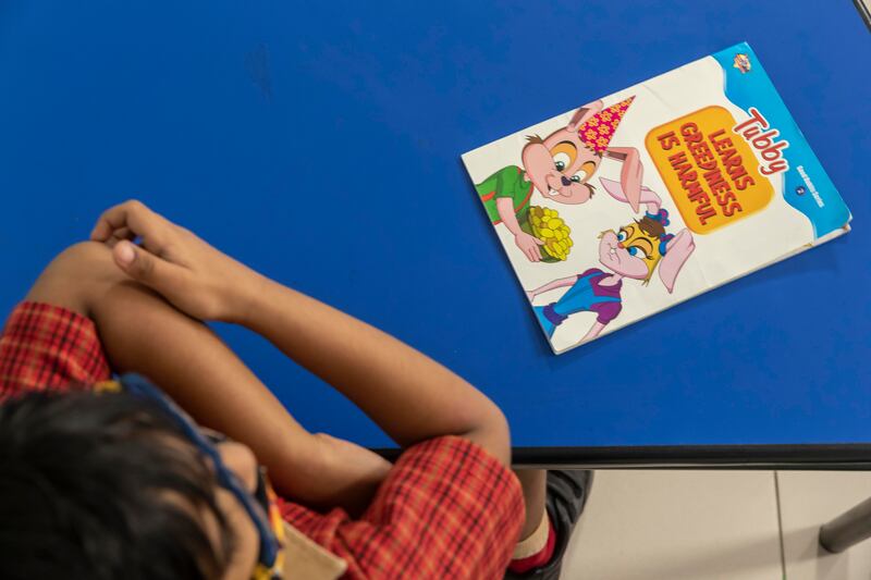 Learning to read at the Delhi Private School.