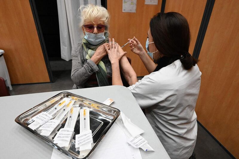 A nurse administers a dose of Pfizer-BioNTech's Covid-19 vaccine at the Beziers vaccination centre at Zinga Zanga village hall, south of France. AFP