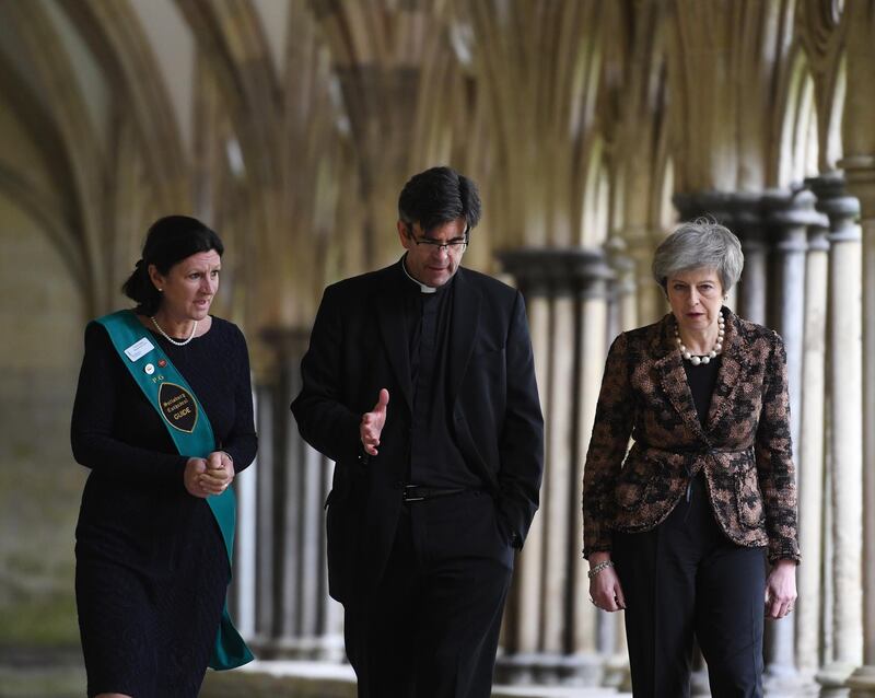 epa07413024 Britain's Prime Minister Theresa May (R) speaks to the Dean of the Cathedral Church of St Mary, Nick Papadopulos (C), and an unidentified guide (L), during a visit to Salisbury, Britain, 04 March 2019. May visited the historic city of Salisbury one year after the Novichok attack on former Russian spy Sergei Skripal and his daughter Yulia. Following initial investigation Prime Minister May told the House of Commons in mid-March 2018 that the nerve agent was of Russian origin and it was most likely that Russia being behind the attack.  EPA/FACUNDO ARRIZABALAGA/POOL
