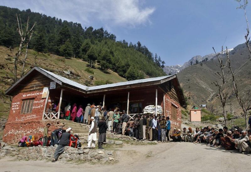 Kashmiri voters stand in line to cast their votes at a polling station in Kangan, east of Srinagar. Danish Ismail / Reuters