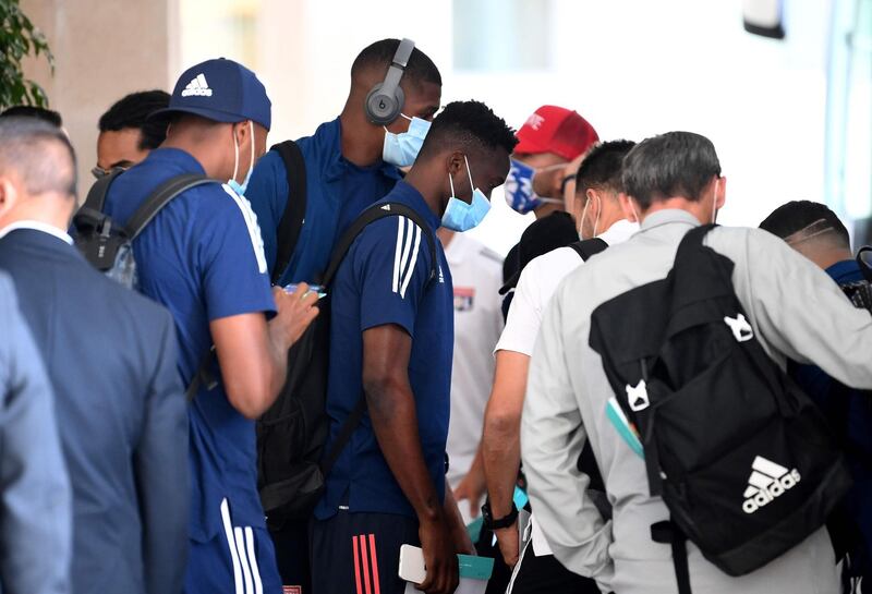 Lyon's players arrive at the team hotel in Cascais. AFP