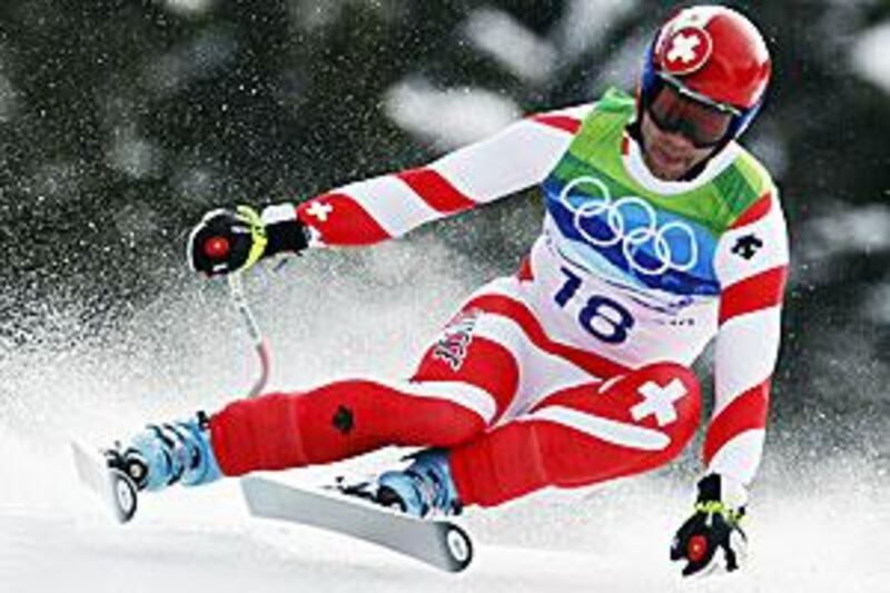 Switzerland's veteran skier, Didier Defago, speeding to a surprise victory in the men's downhill at Whistler on Monday.
