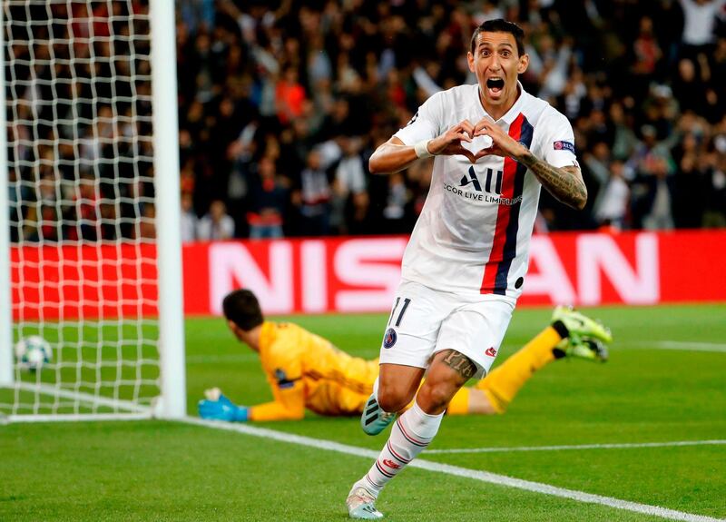 TOPSHOT - Paris Saint-Germain's Argentine midfielder Angel Di Maria celebrates scoring his team's first goal during the UEFA Champions league Group A football match between Paris Saint-Germain and Real Madrid, at the Parc des Princes stadium, in Paris, on September 18, 2019. / AFP / Thomas SAMSON
