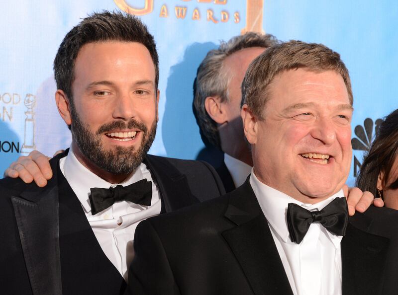 Actor/director Ben Affleck (L) poses in the press room with actor John Goodman after Affleck won the award for best director and best motion picture drama for "Argo" at the Golden Globes awards ceremony in Beverly Hills on January 13, 2013.    AFP PHOTO/Robyn BECK
 *** Local Caption ***  252400-01-08.jpg