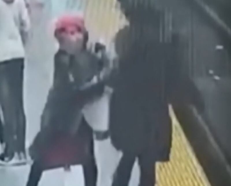 The moment Shamsa Al Balushi is pushed off a subway track in Toronto. Photo: CTV News Toronto