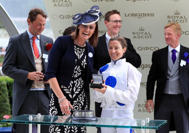 Jockey Hayley Turner poses with her award after winning the Sandringham Stakes on Thanks Be during day four of Royal Ascot at Ascot Racecourse. Press Association