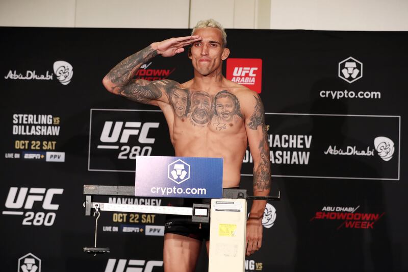 Charles Oliveira weighs in before his lightweight title fight at UFC 280 in Abu Dhabi against Islam Makhachev. Chris Whiteoak / The National