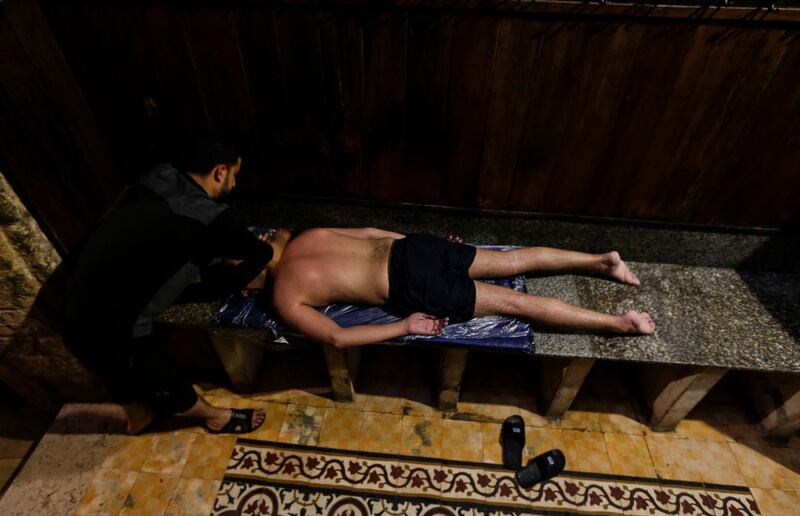 A Palestinian man receives a massage at the ancient Hamam Al Samra in Gaza. AFP