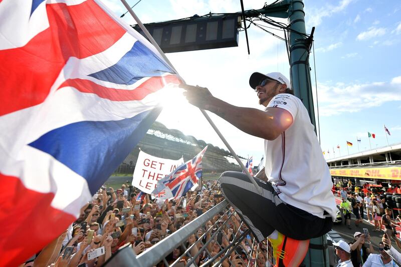 BUDAPEST, HUNGARY - AUGUST 04: Race winner Lewis Hamilton of Great Britain and Mercedes GP celebrates with fans after the F1 Grand Prix of Hungary at Hungaroring on August 04, 2019 in Budapest, Hungary. (Photo by Dan Mullan/Getty Images)