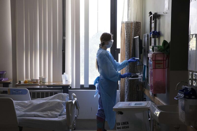 A nurse administers care to a patient in the acute care COVID unit at Harborview Medical Center on May 7, 2020 in Seattle, Washington. AFP