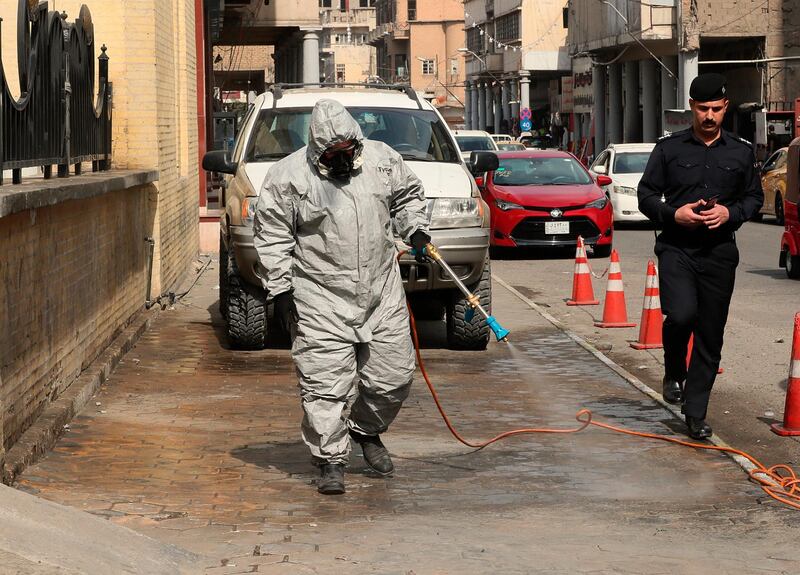 A civil defence worker sprays disinfectant as a precaution against the coronavirus, outside the Artists Syndicate in Baghdad, Iraq. The vast majority of people recover from the new coronavirus. According to the World  Health Organization, most people recover in about two to six weeks, depending on the severity of the illness. AP Photo