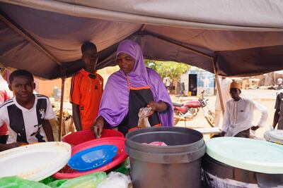 A woman prepares food in Niamey, Niger. AP